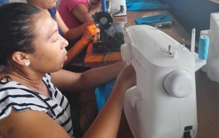 Working on Sewing Machine